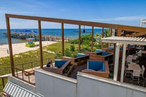 a balcony with a view of a beach and the ocean at Catalina by the Beach 6 in Pompano Beach