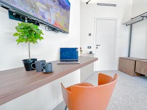 TV a/nebo společenská místnost v ubytování Porta Venezia - Luxy Suites - 6 camere