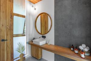 a bathroom with a sink and a mirror at Brand-new luxury Villa Element in Carmen