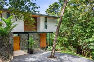 a house in the middle of a forest at Brand-new luxury Villa Element in Carmen +38 photos