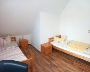 Postel nebo postele na pokoji v ubytování Garni Pension B r o c k e n h e x e + 8 fotografií