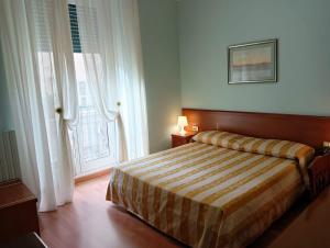 Postel nebo postele na pokoji v ubytování Hotel Arcadia