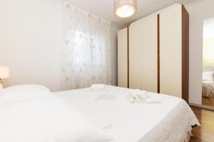 Postel nebo postele na pokoji v ubytování Apartments Emma