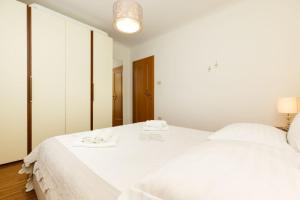 Postel nebo postele na pokoji v ubytování Apartments Emma