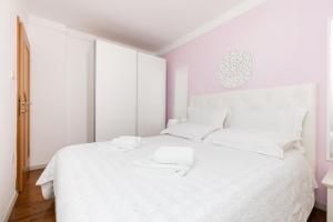 Postel nebo postele na pokoji v ubytování Apartments Emma