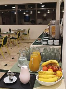 a counter with fruit and juice on a table at ATLAS TOWER HOTEL in Buenos Aires +27 photos