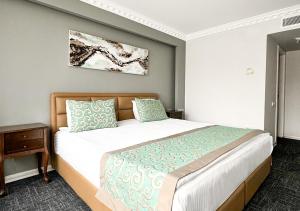 Postel nebo postele na pokoji v ubytování Aldino Hotel & Spa