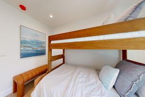 a bedroom with two bunk beds and a bed at Mickey's Hideaway in Anaheim