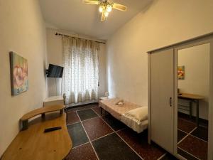 a small room with a bed and a window at Holiday Pisa Gare 2 in Pisa