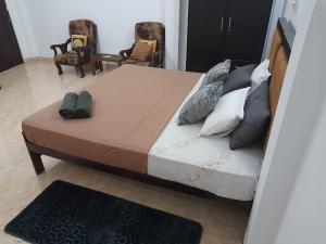 Postel nebo postele na pokoji v ubytování Kismet Rest Mirissa