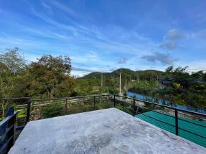 a balcony with a view of the mountains at บ้านสวนชมดาว ปากช่อง in Pak Chong +20 photos