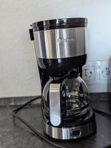 a coffee maker sitting on top of a counter at Ferienwohnung Oker - City Center - Keybox and Balkony in Braunschweig