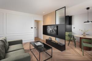 a living room with a couch and a table at Navona Apartment in Labin