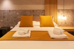 a bedroom with a bed with two towels on it at Residenza San Giovannello in Marsala