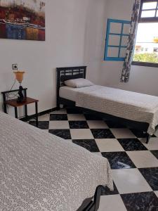 Ένα ή περισσότερα κρεβάτια σε δωμάτιο στο HOTELL Elizia