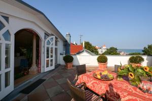 a table with a bowl of fruit on a patio at Meerblick in Binz