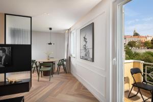 a living room with a stairway leading to a dining room at Navona Apartment in Labin +5 photos