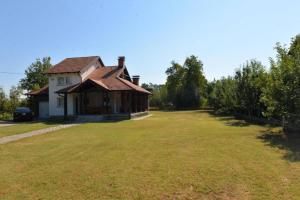 a house with a large yard in front of it at Prijatan odmor u Bijeljini in Bijeljina +19 photos