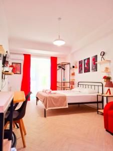 a bedroom with two beds and red curtains at Marjani Terrace Rooms in Tbilisi City