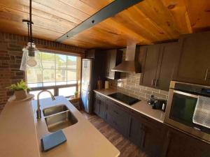 a kitchen with a sink and a counter top at Cozy downtown studio getaway in Kingston