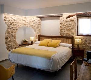 Postel nebo postele na pokoji v ubytování Hotel Mas Aguiló