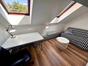a small living room with a couch and a table at Casa curte interioara, centru in Cluj-Napoca +5 photos