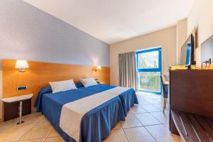 Postel nebo postele na pokoji v ubytování Hotel Rober Palas