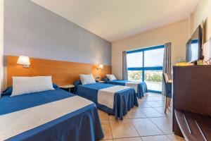 Postel nebo postele na pokoji v ubytování Hotel Rober Palas + 37 fotografií