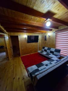 TV a/nebo společenská místnost v ubytování Cabaña piedra azul