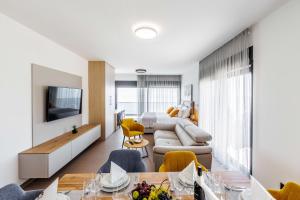 a living room with a couch and a table at Stella Maris in Podstrana