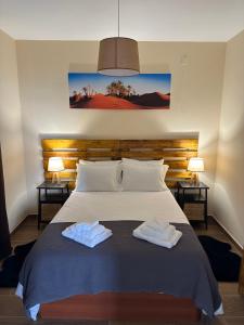 Postel nebo postele na pokoji v ubytování Vila Romana