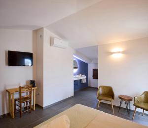 TV a/nebo společenská místnost v ubytování Hotel Mas Aguiló
