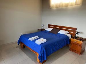 Voodi või voodid majutusasutuse Hostal Cattleya toas