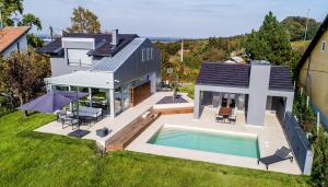 an aerial view of a house with a swimming pool at Villa Darabos in Varaždin Breg