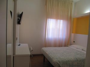 Postel nebo postele na pokoji v ubytování Hotel Sirena