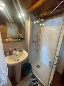 a bathroom with a shower and a sink and a shower at La Carmencita in Cedeira +33 photos