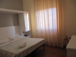 Postel nebo postele na pokoji v ubytování Hotel Sirena