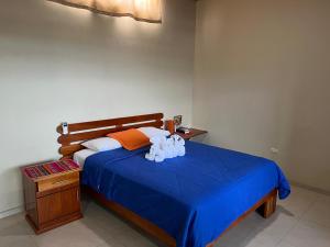 Voodi või voodid majutusasutuse Hostal Cattleya toas