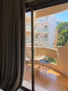 a balcony with a view of a building at Blue Cozy Nest in Rhodes Town