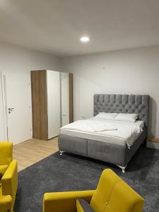 Ένα ή περισσότερα κρεβάτια σε δωμάτιο στο Villa Bella Una-Apartman