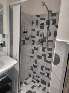 a bathroom with a shower and a sink at Kamurria House in Catania