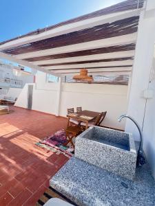 Khu vực ghế ngồi tại Casa Tropical - maison typique dans le centre historique d'Olhao