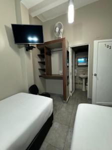 Cama ou camas em um quarto em Hotel Residencial Alfa