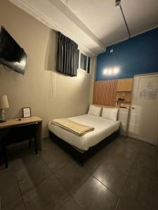 Cama ou camas em um quarto em Hotel Residencial Alfa
