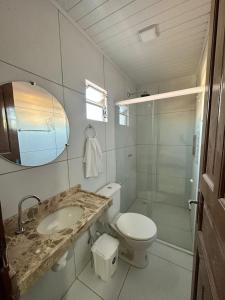 a bathroom with a sink and a toilet and a shower at Vento Leste Suites in Flecheiras +19 photos