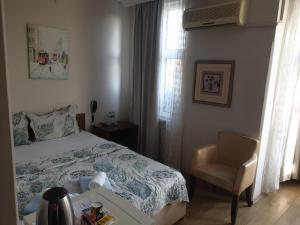 Postel nebo postele na pokoji v ubytování Hotel Acar
