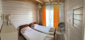 Postel nebo postele na pokoji v ubytování SeaStar Eco Villa