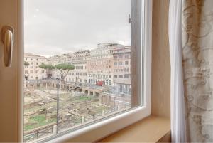 a window with a view of a city at Sun Suite Luxury Pantheon in Rome
