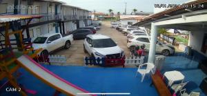 a group of cars parked in a parking lot at Pousada Ilha do Sol in Salinópolis