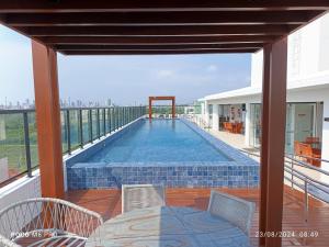 a swimming pool on the balcony of a building at Apto Praia Intermares Cabedelo Paraiba Q208 in Nossa Senhora do Livramento